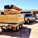 hardwood on trailer behind pickup truck - Hughes Hardwoods, CA